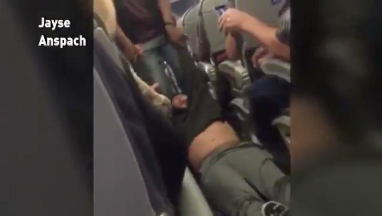 dragged man, united airlines, shocking video